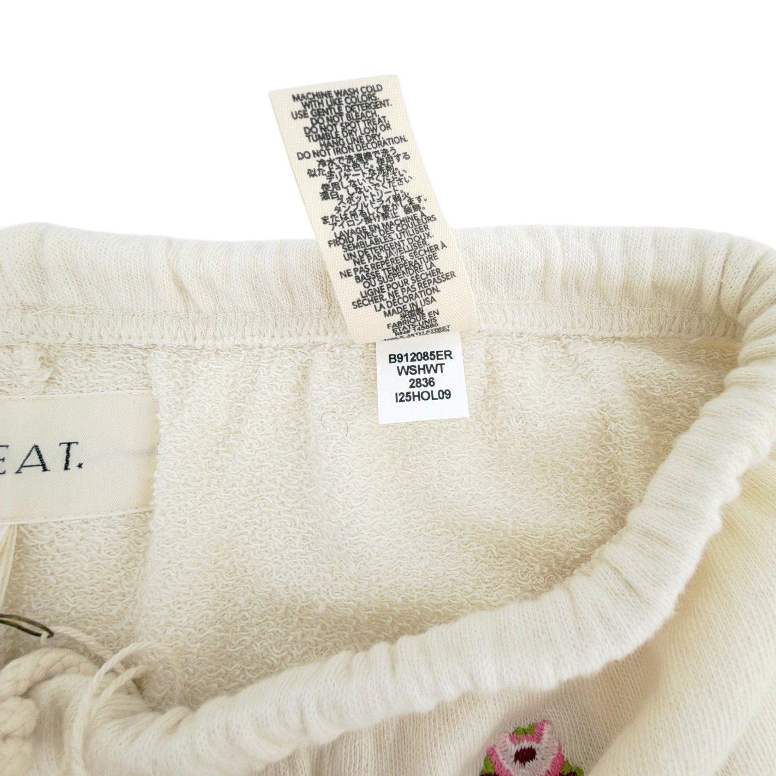 THE GREAT. The Stadium Sweatpant. Washed White with Embroidered Roses 1|S The Great.