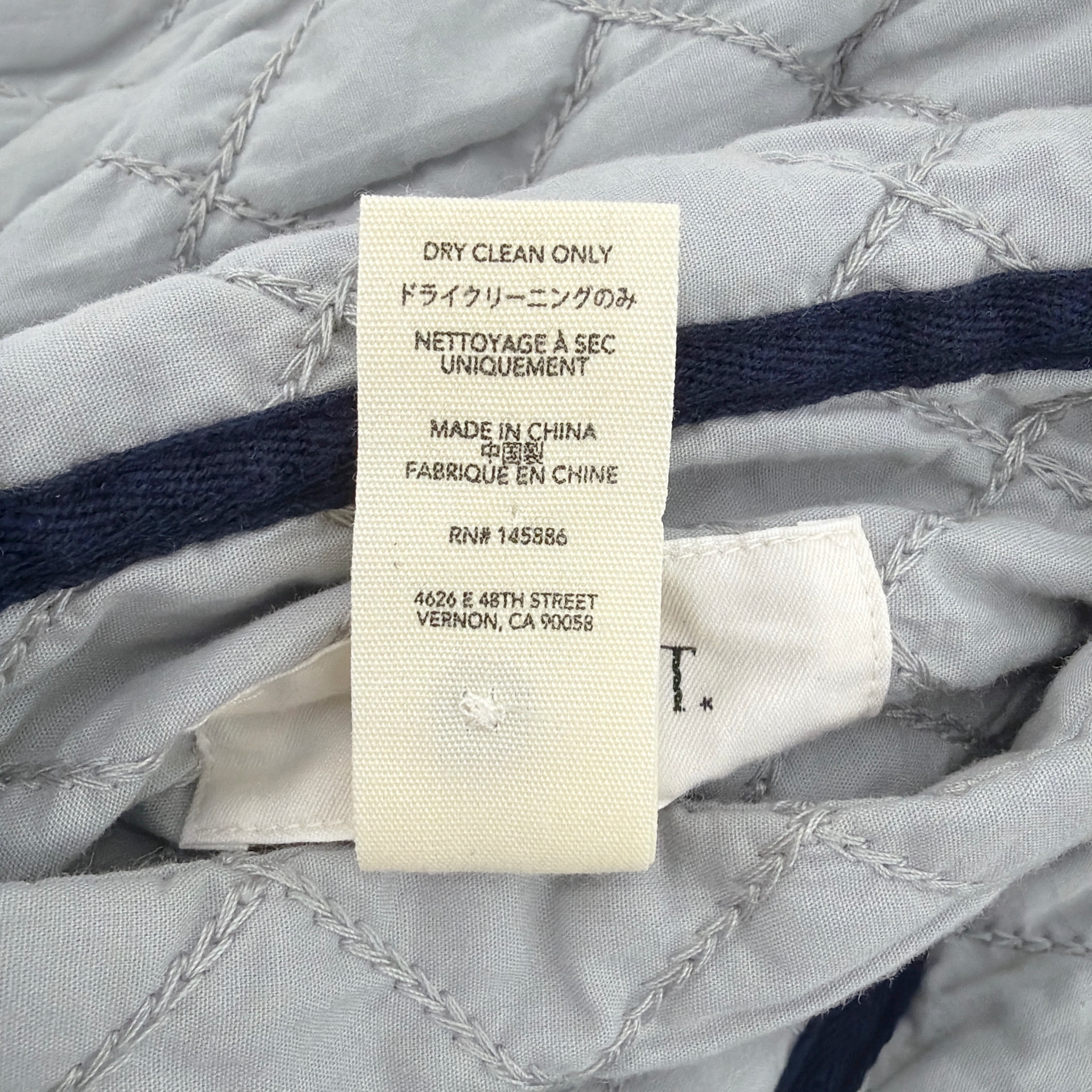 THE GREAT. The Short Quilted Reversible Jacket in Stone Blue 0|XS The Great.